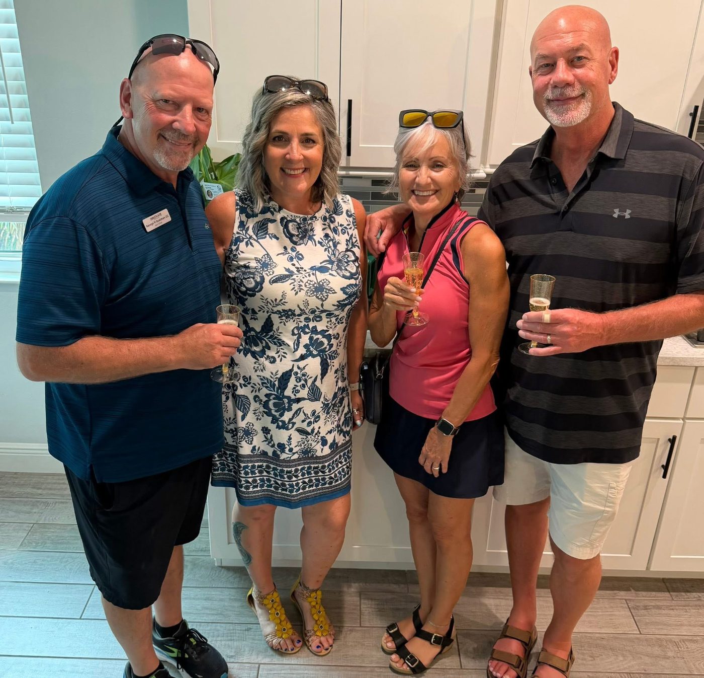 Danielle and George toasting with clients on closing day