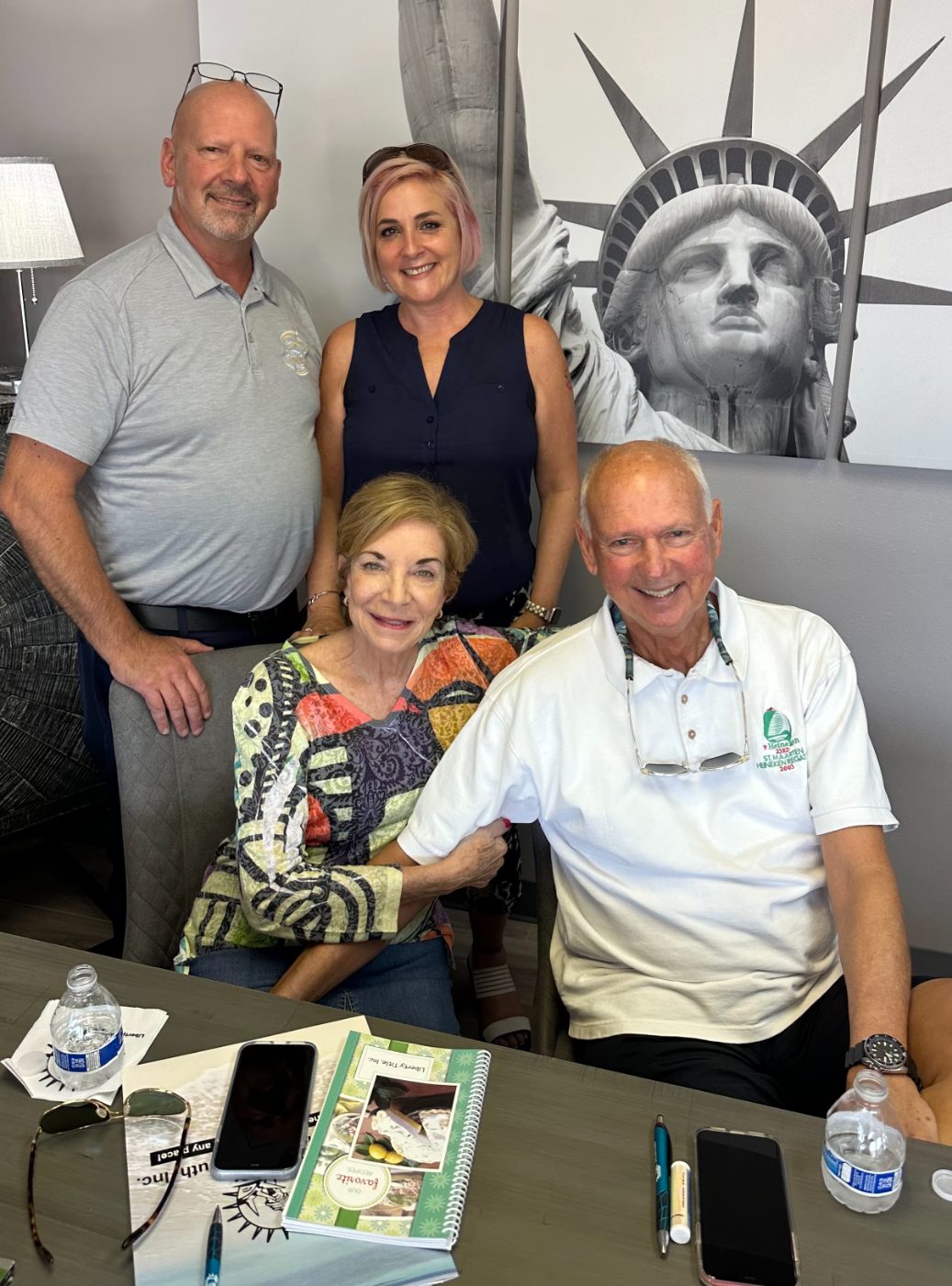 Danielle and George with clients at the closing table